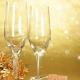 Champagne glasses on golden background